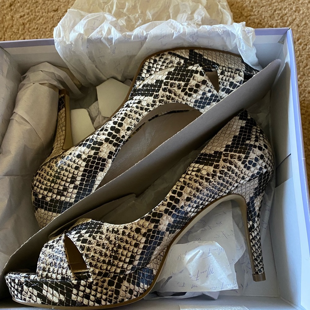Size 8 Marc Fisher snake skin peep toe sandals. New in the box never worn.